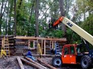 Fork lift placing logs into place